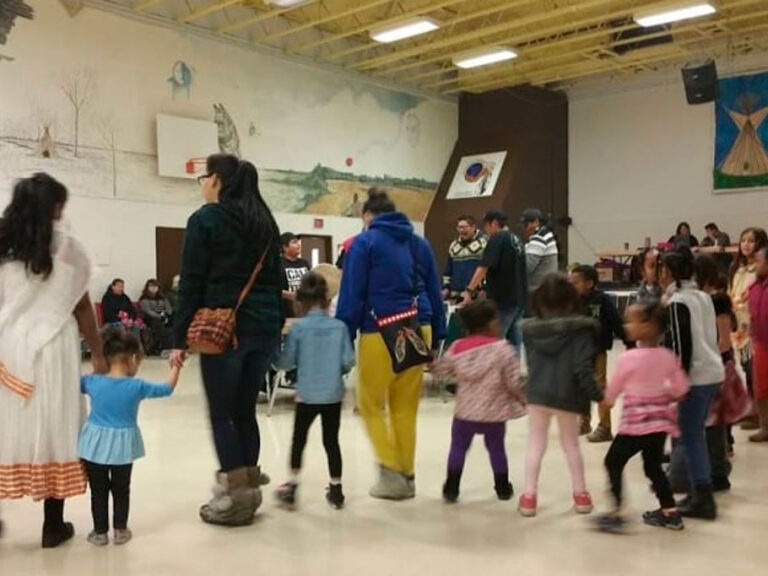 3. Community round dance in auditorium